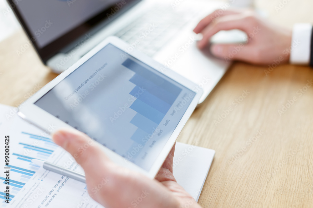 businessman checking financial reports on table businessman checking financial reports on table