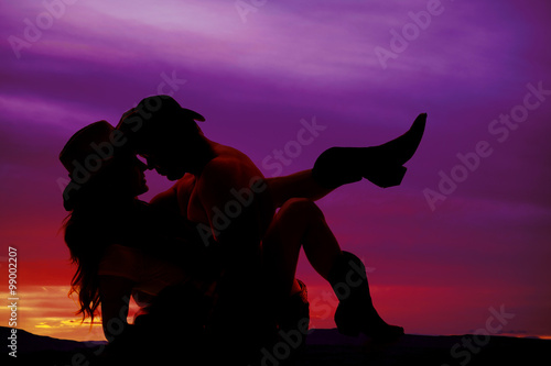 silhouette of cowboy and cowgirl faces close