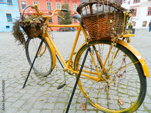 Old Bicycle Equipped with Basket in Sighisoara citadel central s