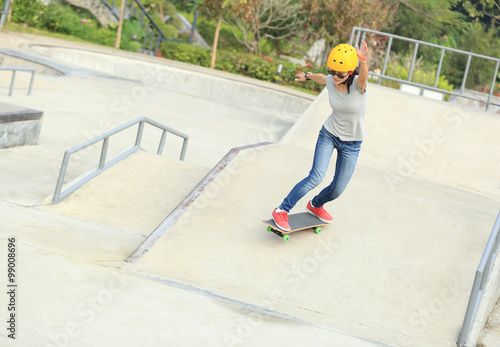 skateboarding woman at skatepark