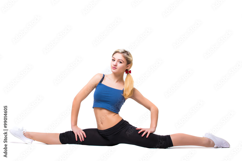Attractive fit woman exercising in studio with copyspace. Image of healthy young female athlete doing fitness workout against grey background. Attractive fit woman exercising in studio with copyspace. Image of healthy young female athlete doing fitness workout against grey background.