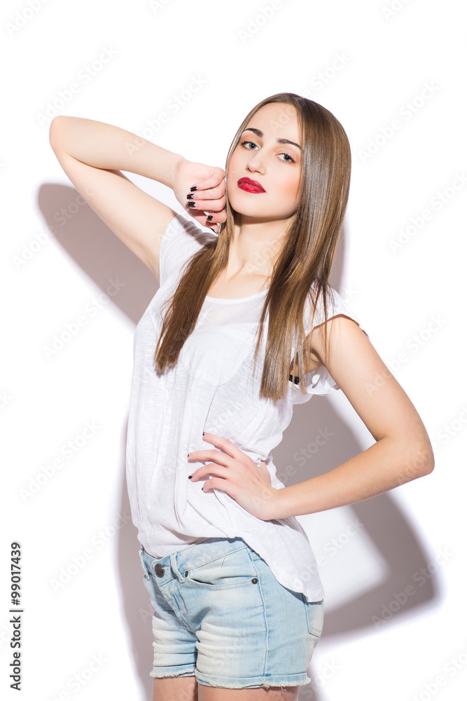 Sexy young girl in denim shorts shirt studio Sexy young girl in denim shorts shirt studio