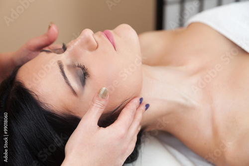 Beautiful woman getting a face massage