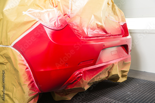 Vászonkép Car masked with some tape and paper sprayed with red paint