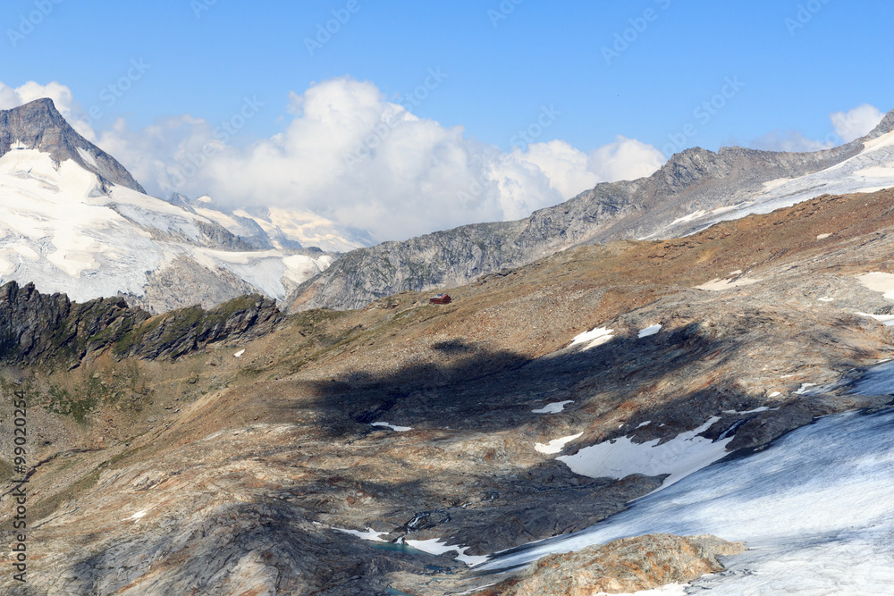 Alpine hut Defreggerhaus at Großvenediger glacier and mountain panorama in the Hohe Tauern Alps, Austria