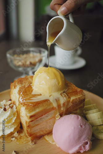 honey toast on the wood dish in coffee shop