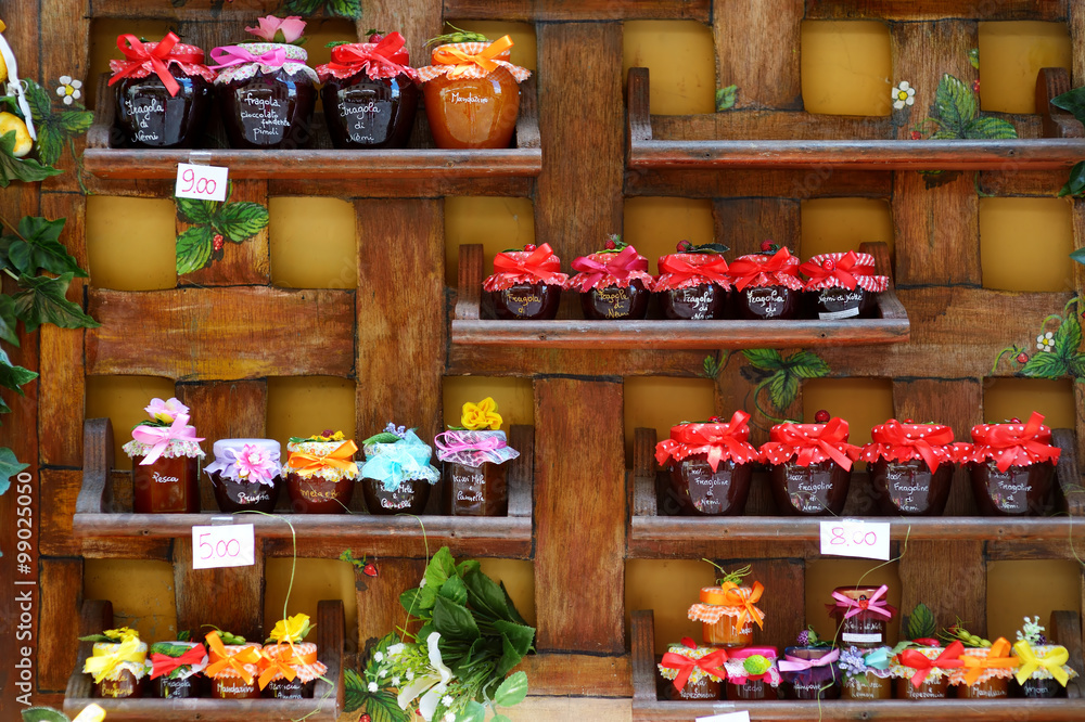 Colorful jam jars arranged for sale in Nem