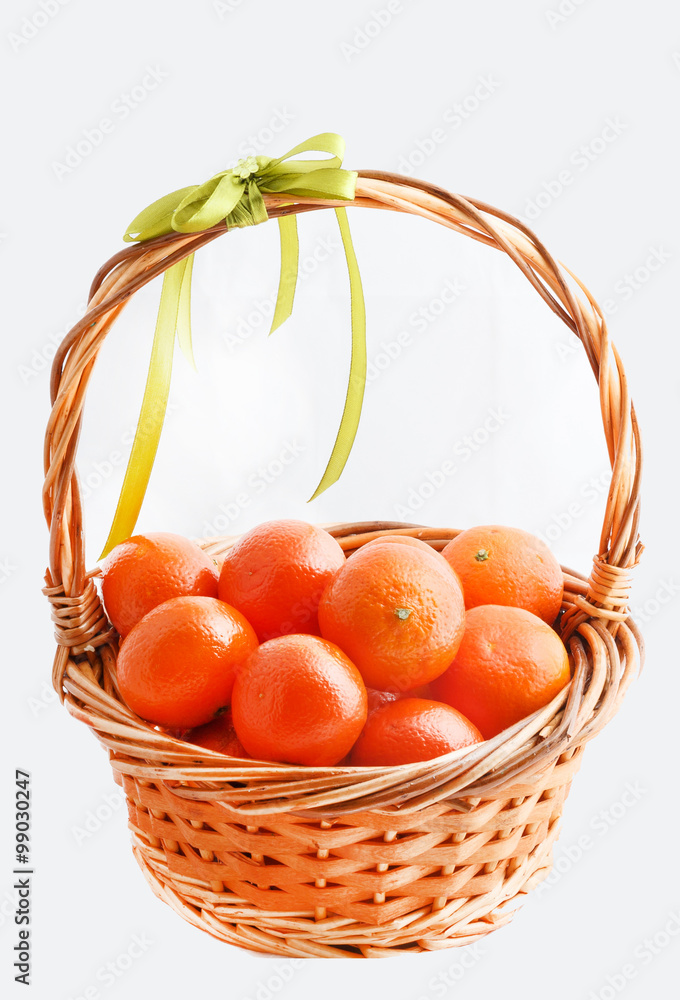 organic ripe mandarins in basket on white background