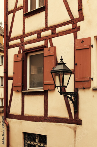 Fragment of facade of medieval house with lantern