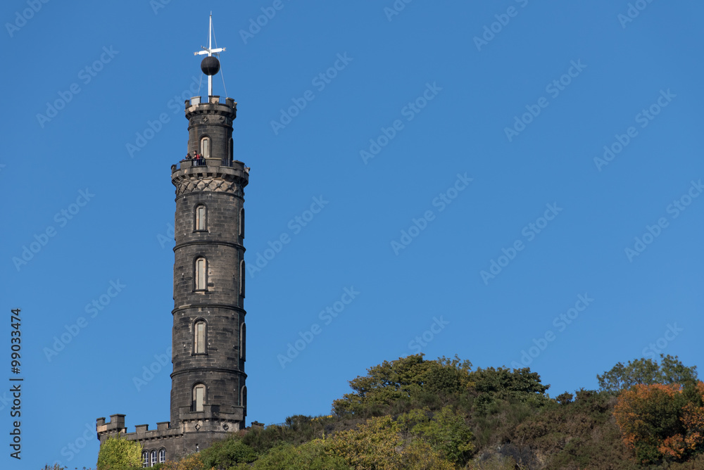 Nelsons Monument on Carlton Hill in Edinburgh Scotland. The Ball is right at the top of its travel so it is just before 1PM.
