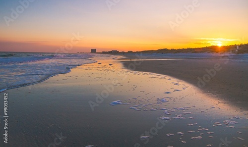 Myrtle Beach Sunset. Sunset on a wide Atlantic Ocean beach with the popular resort town of Myrtle Beach, South Carolina in the background. photo