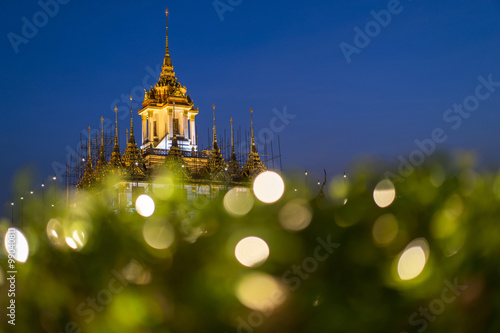 Loha Prasat Metal Palace in Wat ratchanadda with bokeh foreground, Bangkok, Thailand photo