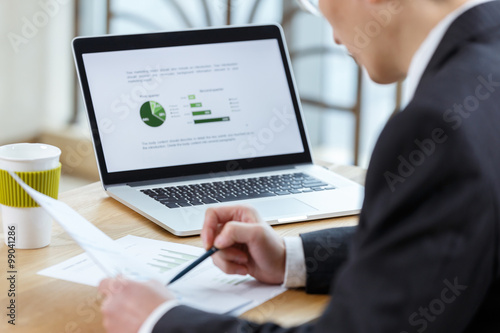 businessman checking financial reports