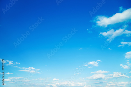 white fluffy clouds in the blue sky © ZaZa studio