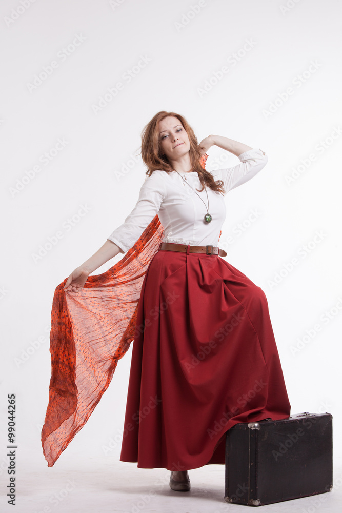 woman in skirt dancing with a red handkerchief