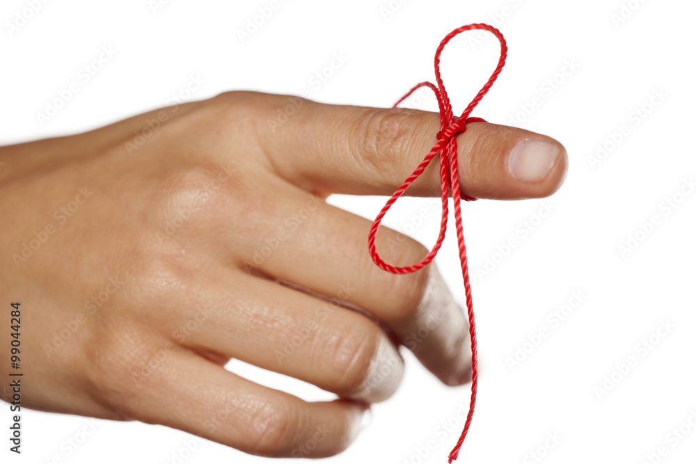 index finger tied with a red rope index finger tied with a red rope