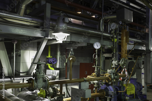 abstract interior of the plant: pipes valves, steel construction