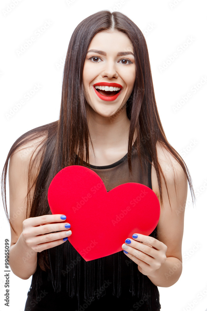 Beautiful woman holding heart shaped valentine card and smiling Beautiful woman holding heart shaped valentine card and smiling