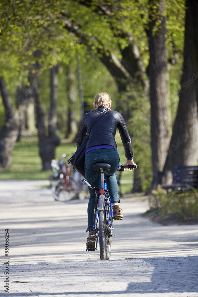 Woman on the bicycle in park