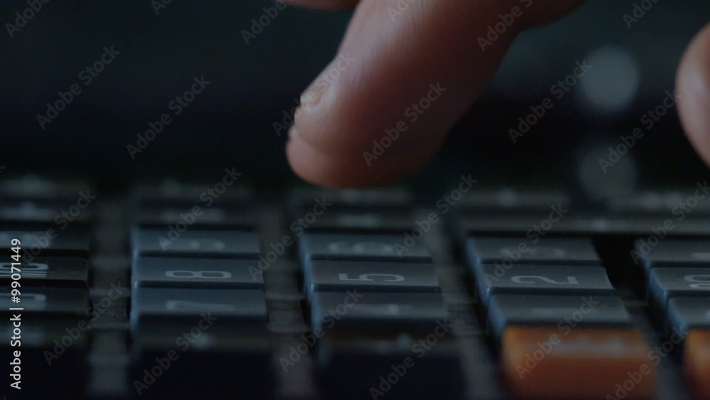 Close-up of male hand Using calculator Close-up of male hand Using calculator