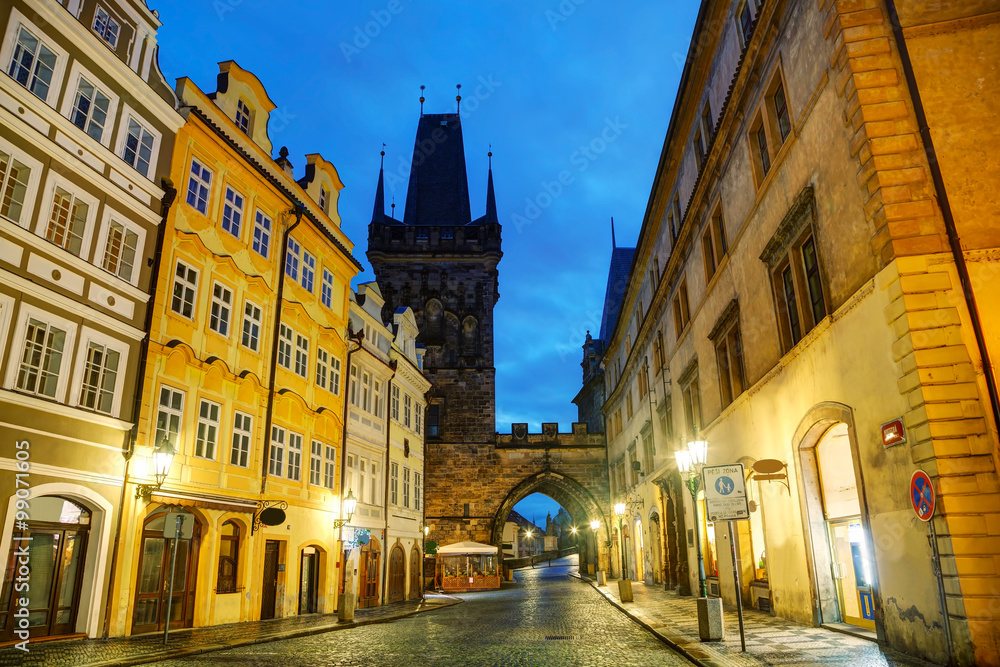 Old Prague street with Charles bridge