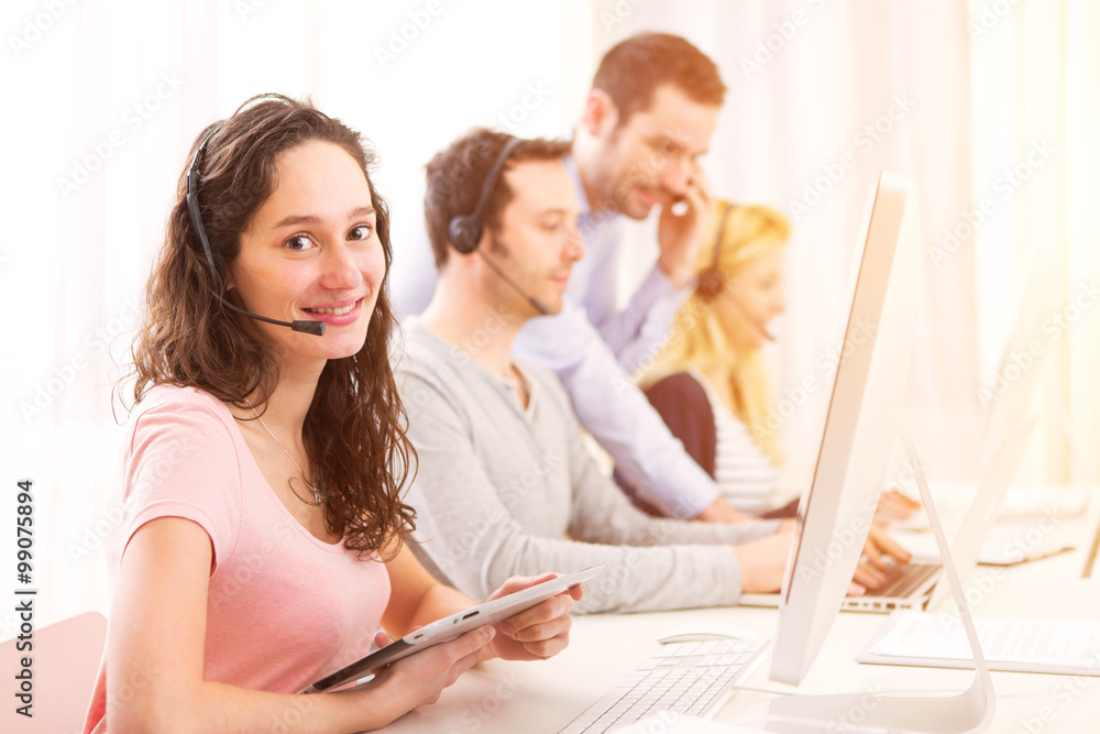 Young attractive woman working in a call center Young attractive woman working in a call center