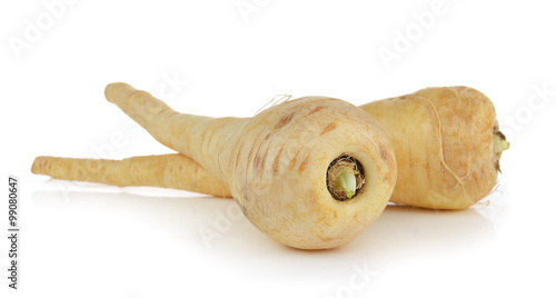  fresh parsnip roots on a white background