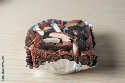 almond chocolate brownies stacked on the wooden