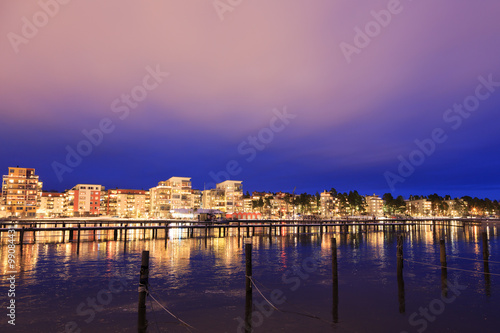 Vasteras skyline in sunset with lake Malaren in the front.