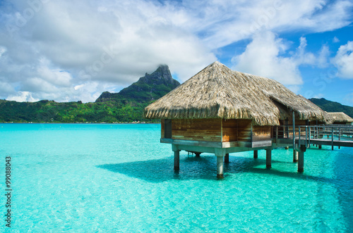 Thatched roof honeymoon bungalow on Bora Bora © iPics