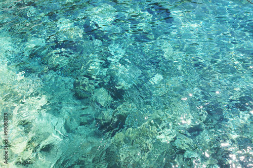 Azure clear Mediterranean sea on Santorini island.