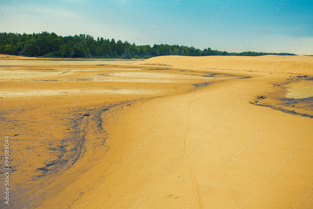 sandy beach after low tide sandy beach after low tide