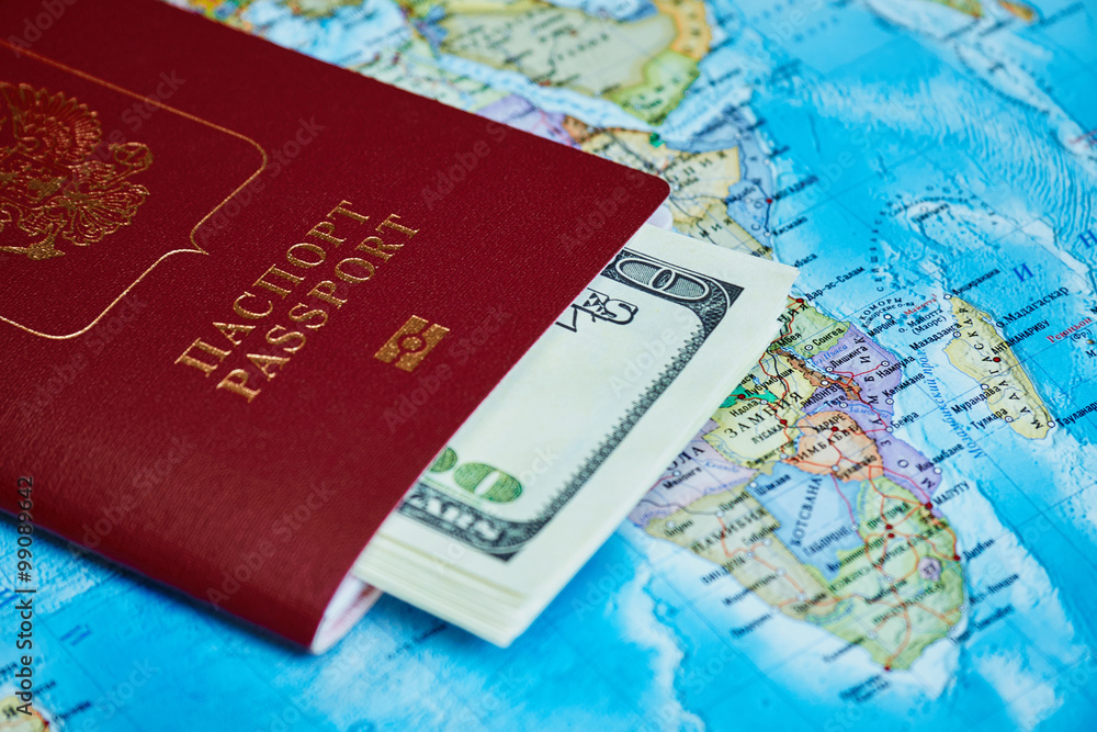 Passport and money on a topographic map Passport and money on a topographic map