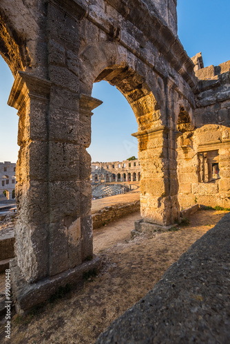 Obraz na płótnie Architecture Details of the Roman Amphitheater Arena in Sunny Summer Evening. Famous Travel Destination in Pula, Croatia. w salonie