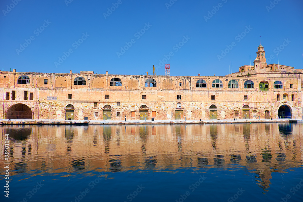 Fototapeta premium The old dock building at Bormla (Cospicua) waterfront. Malta.