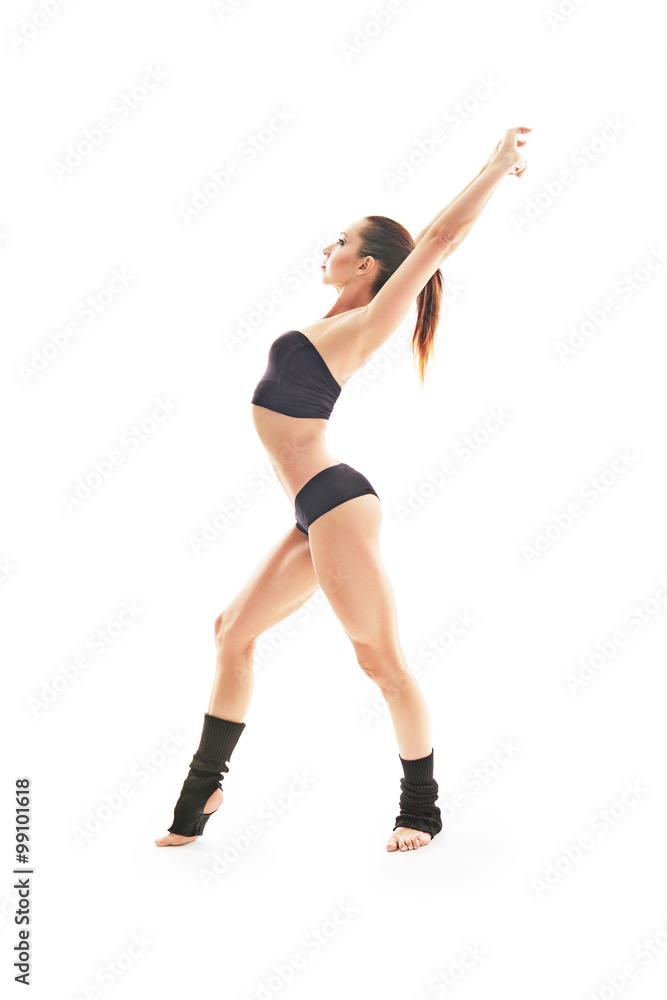 Young beautiful ballet dancer posing on a studio Young beautiful ballet dancer posing on a studio