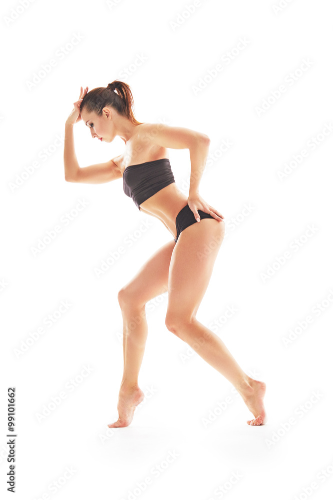 Young beautiful ballet dancer posing on a studio Young beautiful ballet dancer posing on a studio
