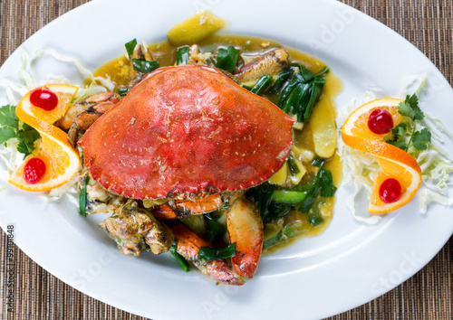 Whole cooked Dungeness crab with green onion sauce 