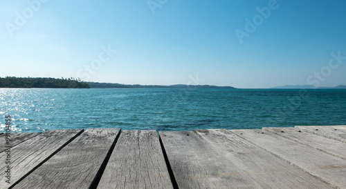Fototapeta Naklejka Na Ścianę i Meble -  Wood Terrace on The Beach with Clear Sky and Blue Sea