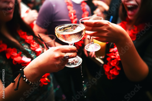 Clinking glasses and toasting