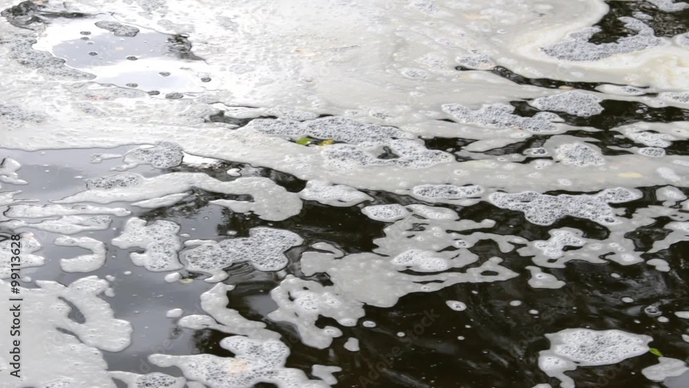 Polluted river water. Polluted river water.