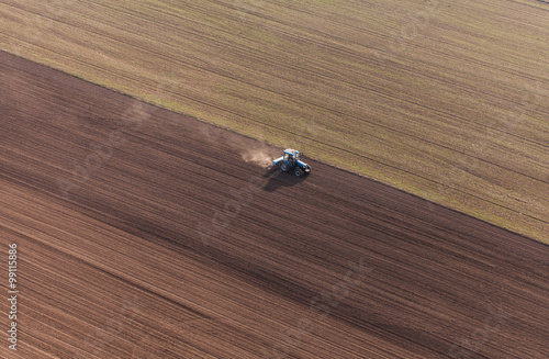 aerial view of harvest fields with tractor