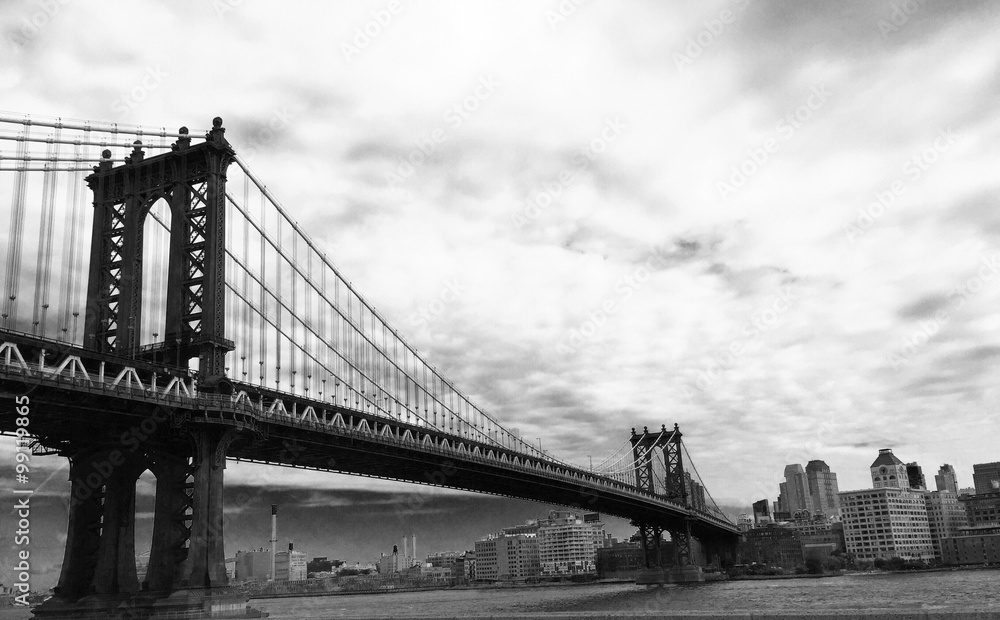 manhattan bridge with cloudy sky in black and white picture style
