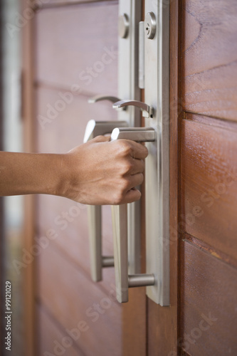hand hold handle of wood door