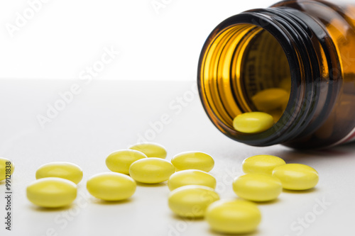 Isolated shot of yellow pharmaceutical drugs - pills