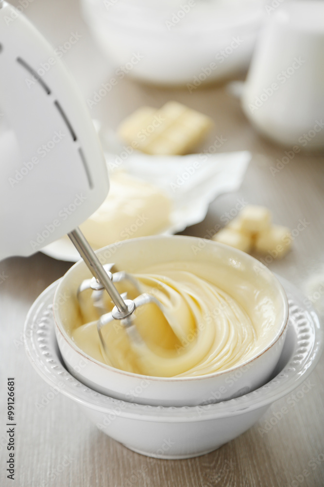 Cooking buttery cream on kitchen Cooking buttery cream on kitchen
