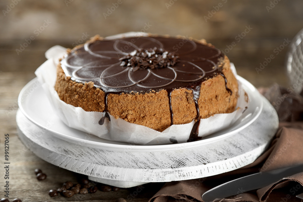 Tasty chocolate cake on wooden background Tasty chocolate cake on wooden background