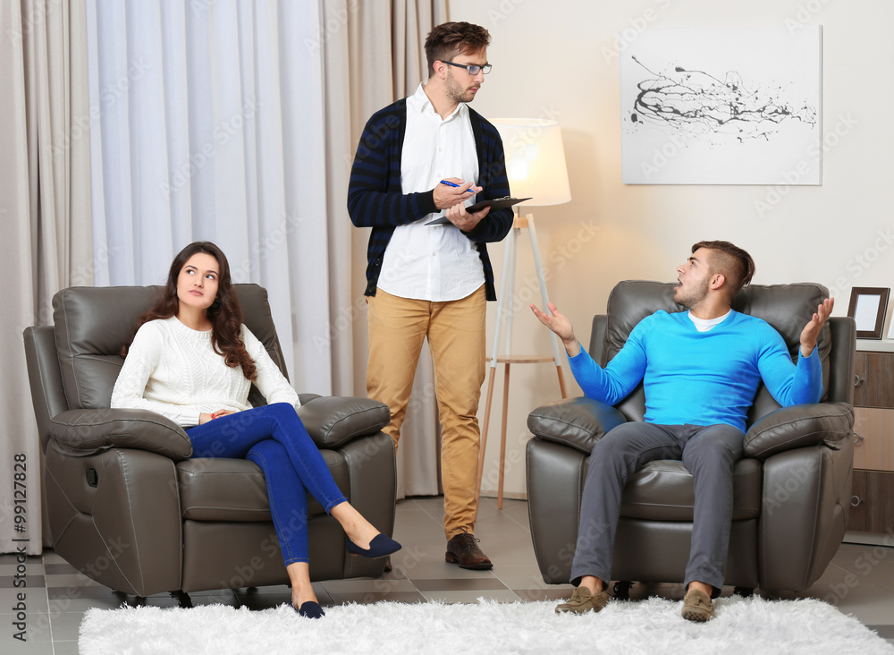 Young couple with problem on reception for family psychologist Young couple with problem on reception for family psychologist