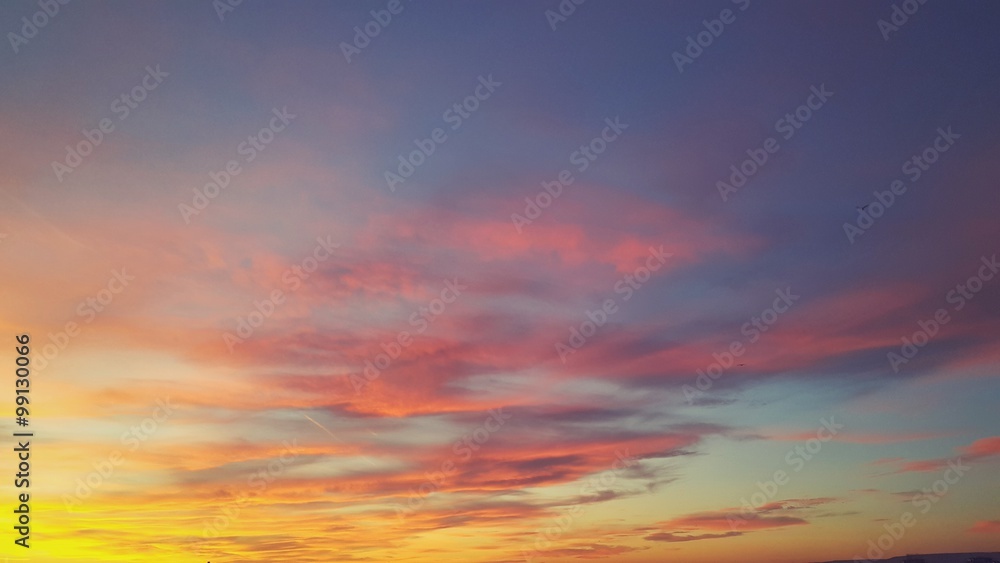 Colorful sunset, sky with clouds as a background