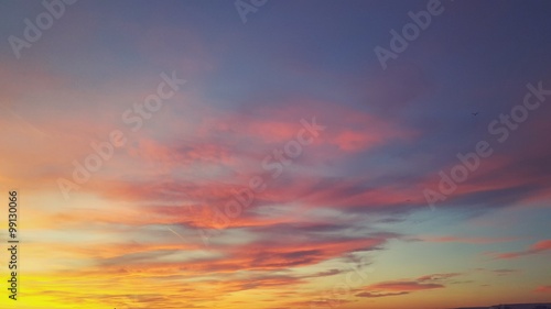 Colorful sunset, sky with clouds as a background